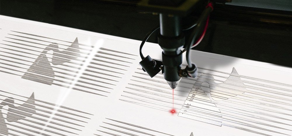Seripress technician operating manufacturing equipment in the workshop