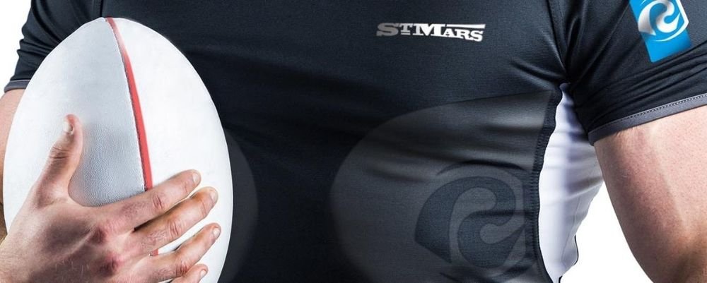 Rugby player wearing a jersey printed with the "St Mars" logo