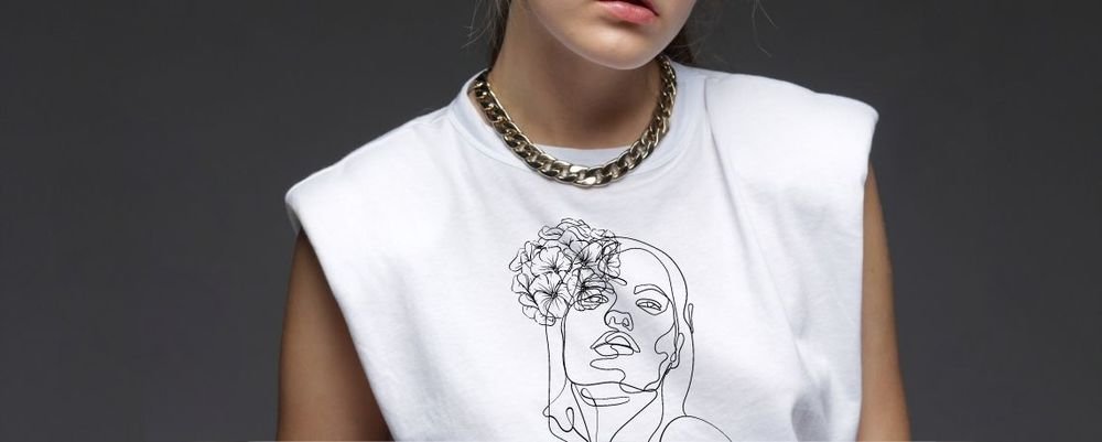 Floral and face line-art transfer on a white tank top